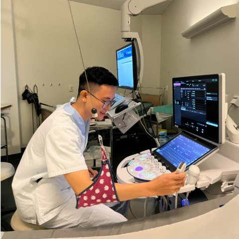 Albert Pham at an ultrasound machine